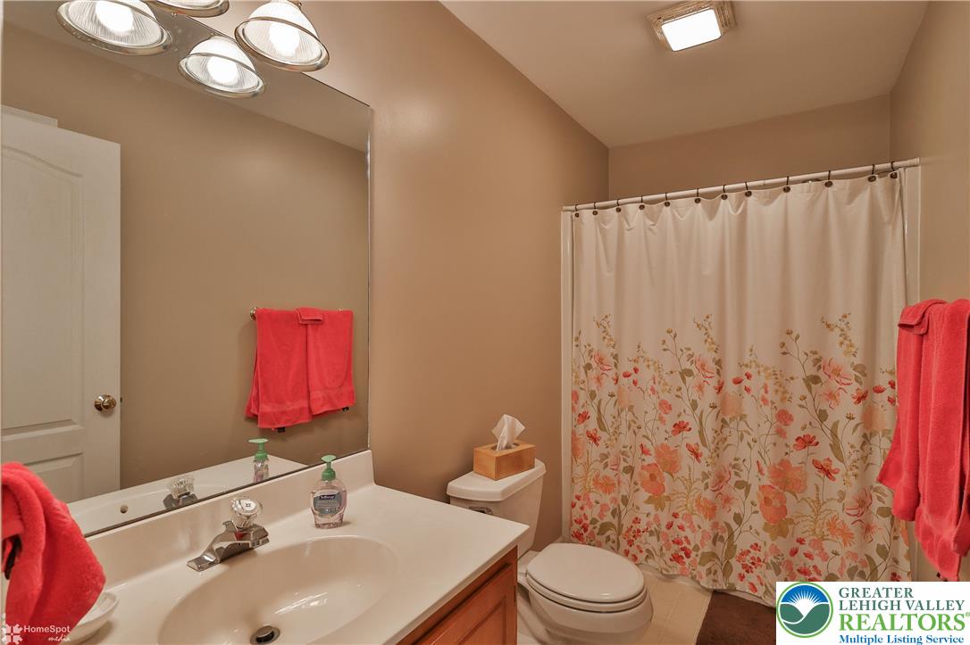 521 South New Street Nazareth, PA 18064 - Photo 23 of 29 a bathroom with a sink a toilet and shower curtain