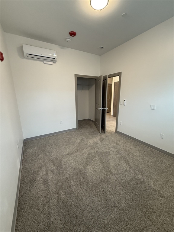 626 Main Street, Unit 110 Dennis, MA 02639 - Photo 5 of 14 a view of an empty room with a window