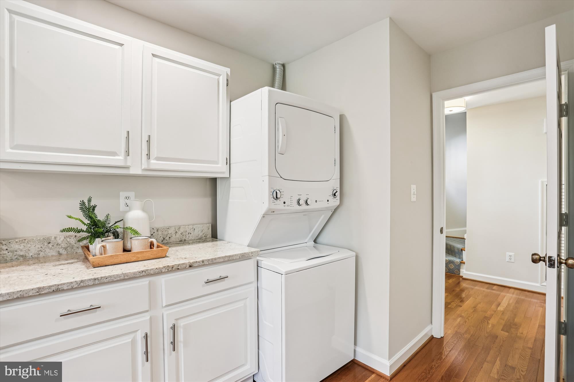 6734 Hillandale Road, Unit 9 Chevy Chase, MD 20815 - Photo 12 of 51 Stackable washer and dryer in kitchen