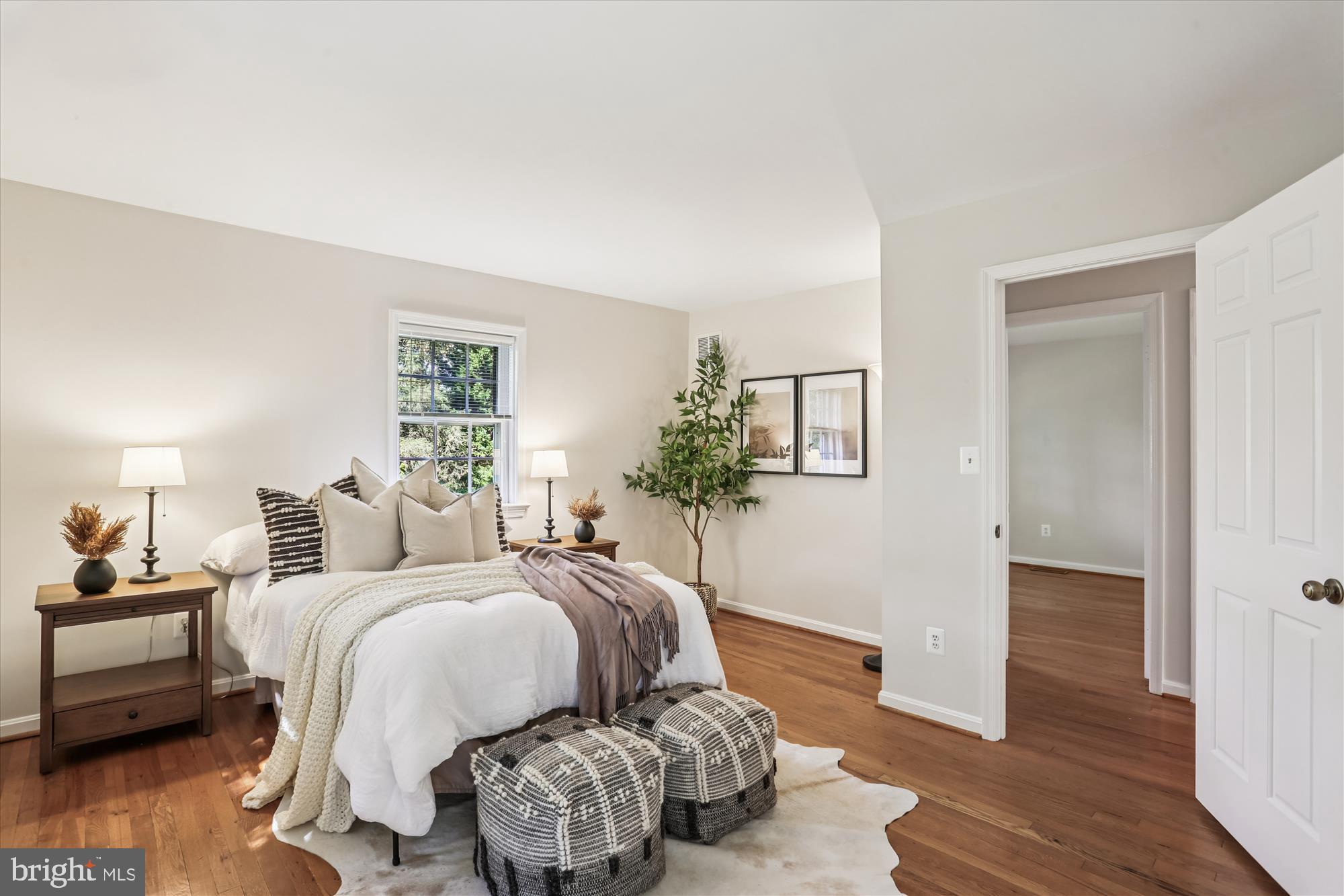 6734 Hillandale Road, Unit 9 Chevy Chase, MD 20815 - Photo 27 of 51 Primary bedroom suite with hardwood flooring