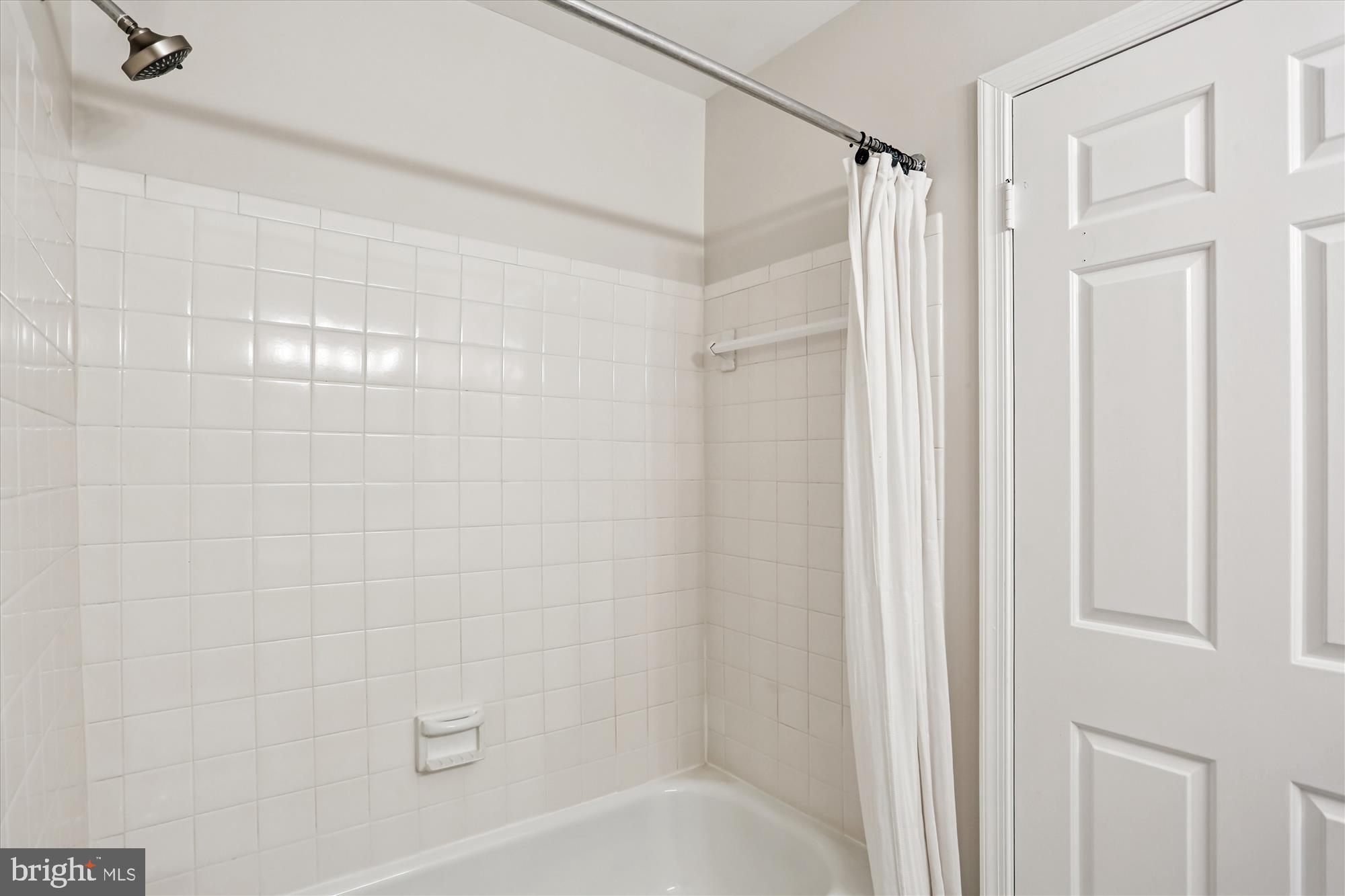 6734 Hillandale Road, Unit 9 Chevy Chase, MD 20815 - Photo 38 of 51 Hall bath with ceramic tile tub/shower