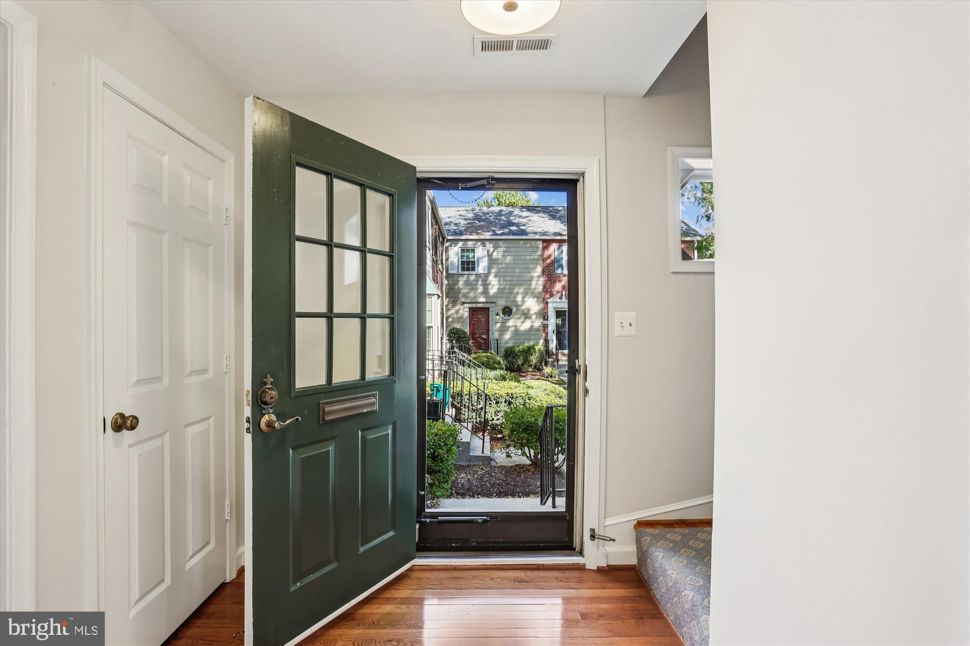 6734 Hillandale Road, Unit 9 Chevy Chase, MD 20815 - Photo 6 of 51 Foyer entry with storm door and new lighting