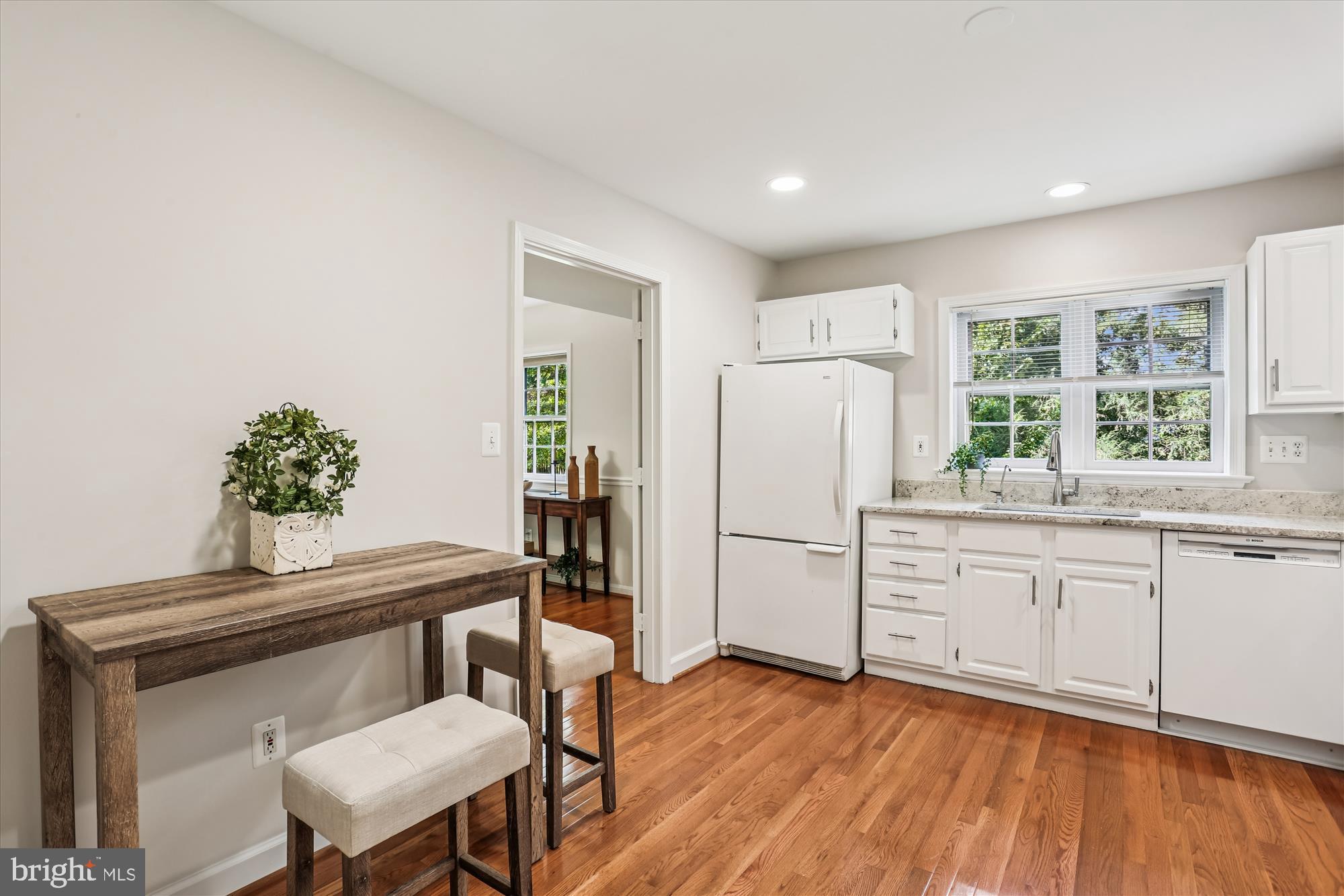 6734 Hillandale Road, Unit 9 Chevy Chase, MD 20815 - Photo 10 of 51 Table-sized kitchen with hardwood flooring