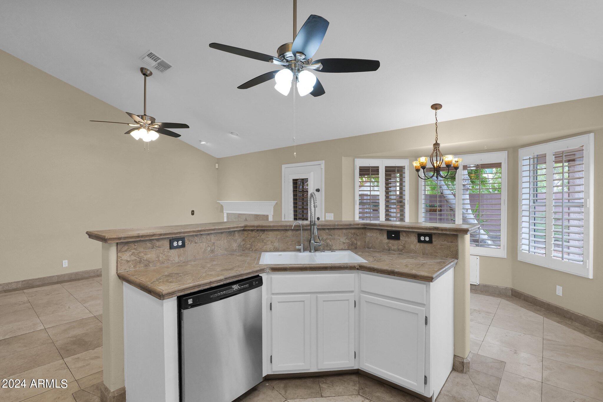 3218 North Ravine Mesa, AZ 85215 - Photo 11 of 36 Kitchen Island Overlooks Family Room