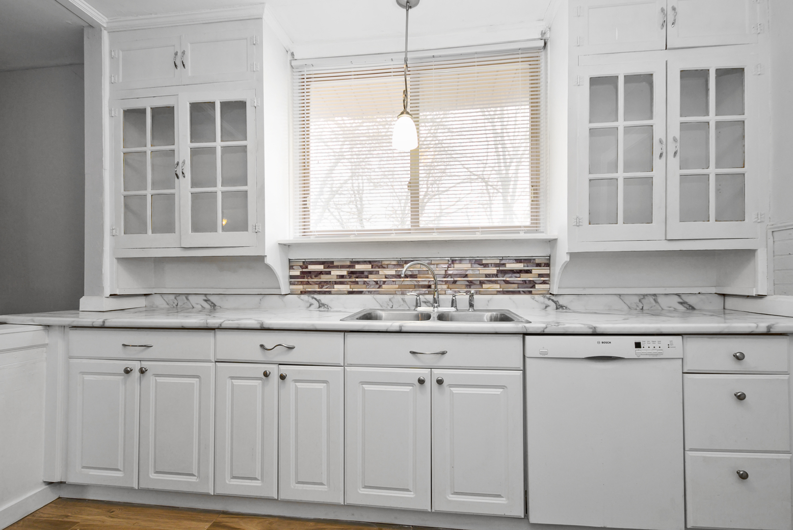 14823 Grant Street Dolton, IL 60419 - Photo 14 of 37 a kitchen with granite countertop white cabinets and a window