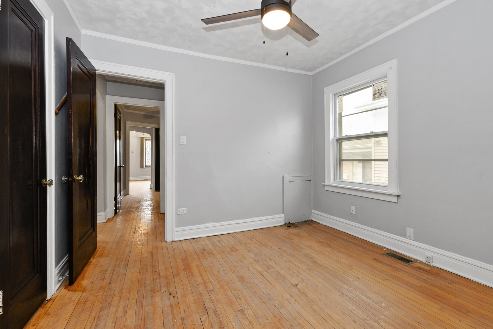 14823 Grant Street Dolton, IL 60419 - Photo 20 of 37 a view of livingroom with hardwood floor and window