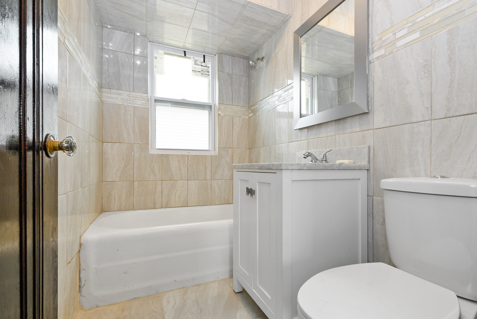 14823 Grant Street Dolton, IL 60419 - Photo 21 of 37 a bathroom with a sink a toilet and bathtub