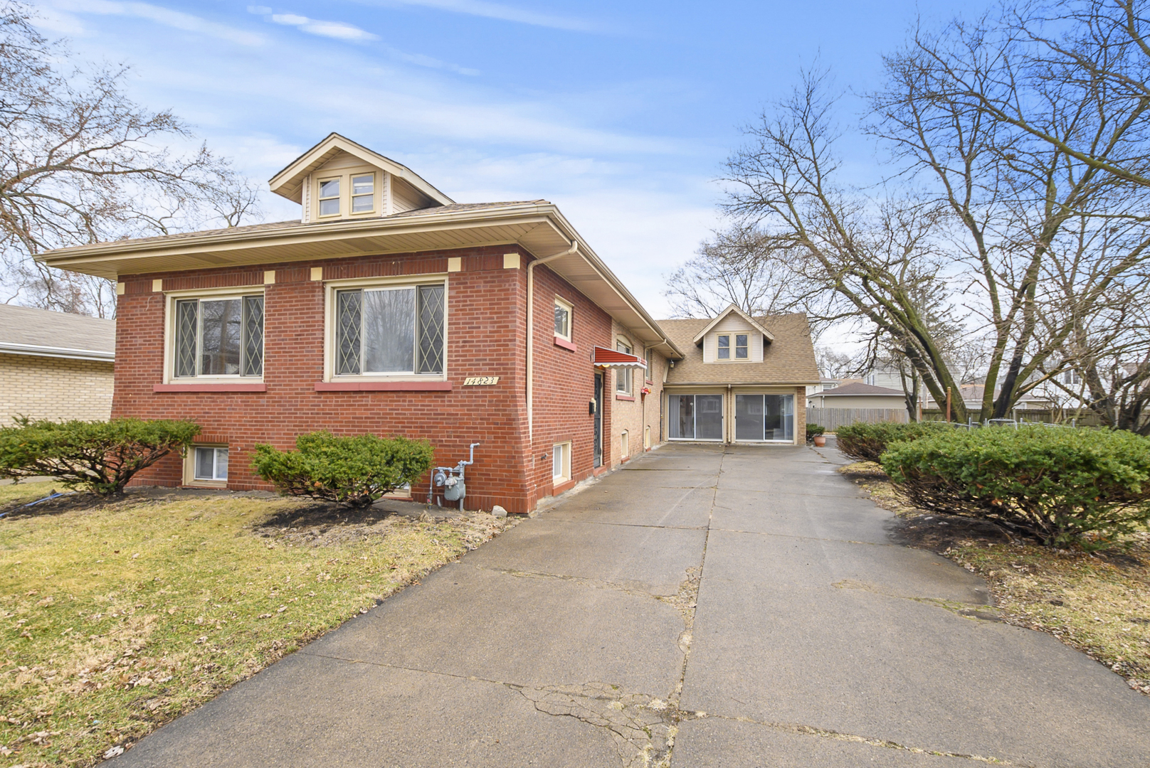 14823 Grant Street Dolton, IL 60419 - Photo 3 of 37 front view of a house with a garden
