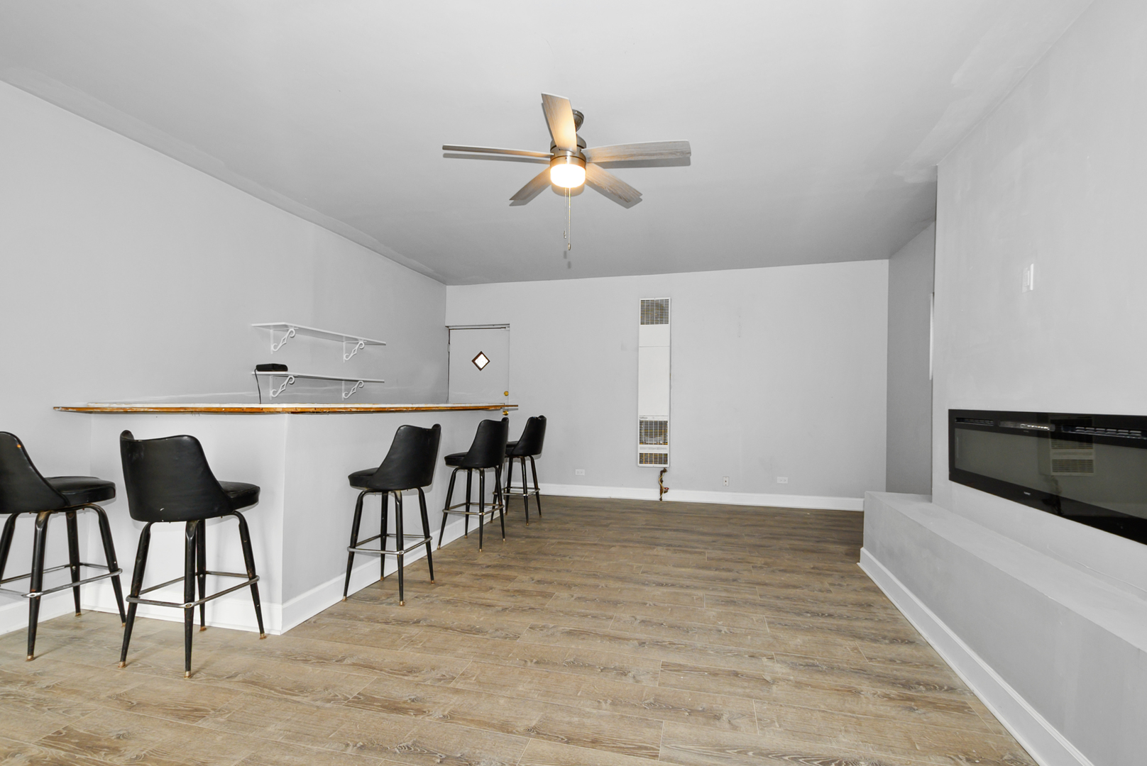 14823 Grant Street Dolton, IL 60419 - Photo 5 of 37 a kitchen with cabinets table and chairs