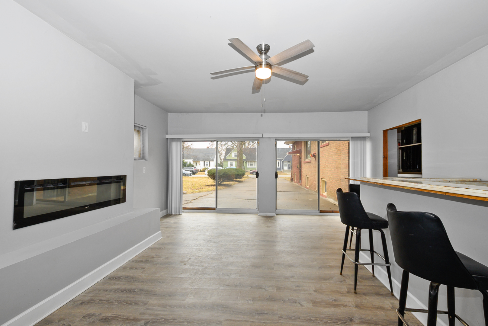 14823 Grant Street Dolton, IL 60419 - Photo 6 of 37 a living room with furniture and a large window