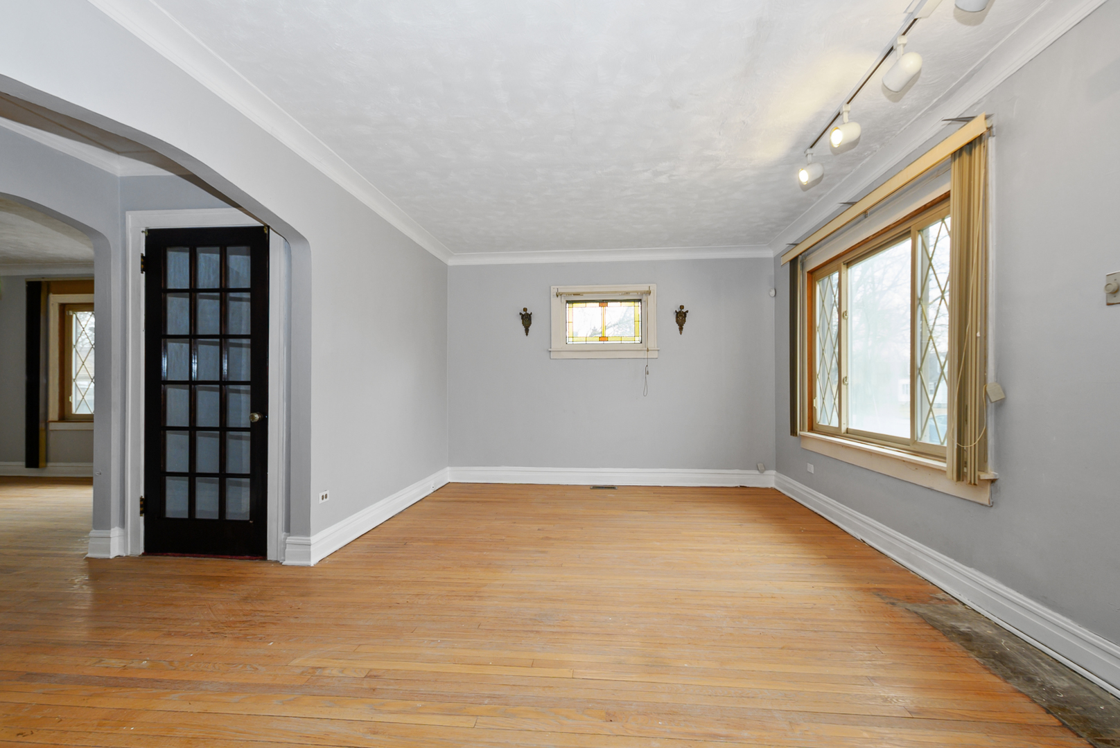 14823 Grant Street Dolton, IL 60419 - Photo 10 of 37 a view of an empty room with window and wooden floor