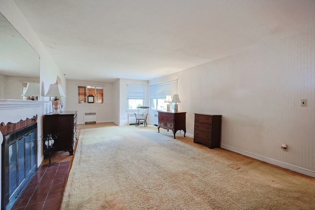 58 Cutler Drive Framingham, MA 01702 - Photo 14 of 35 a living room with furniture and a flat screen tv