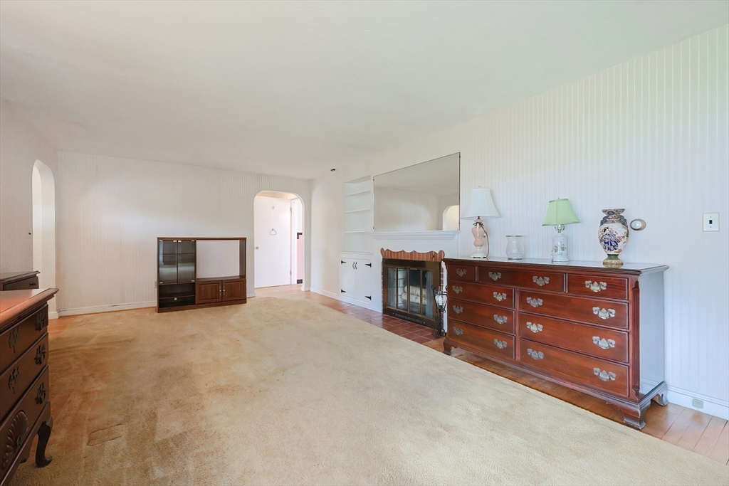 58 Cutler Drive Framingham, MA 01702 - Photo 15 of 35 a living room with furniture and a fireplace