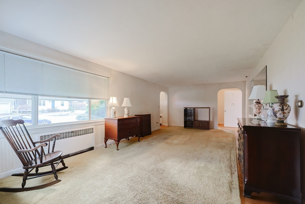 58 Cutler Drive Framingham, MA 01702 - Photo 16 of 35 a view of a livingroom with furniture and a kitchen