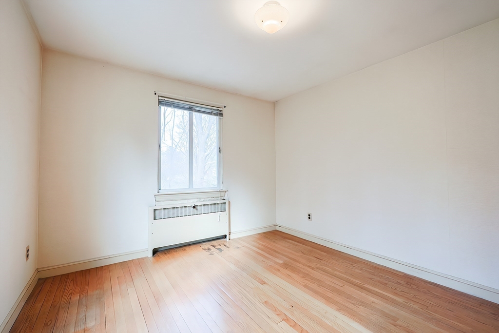 58 Cutler Drive Framingham, MA 01702 - Photo 22 of 35 an empty room with wooden floor
