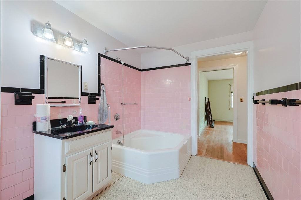 58 Cutler Drive Framingham, MA 01702 - Photo 23 of 35 a bathroom with a bathtub and a shower