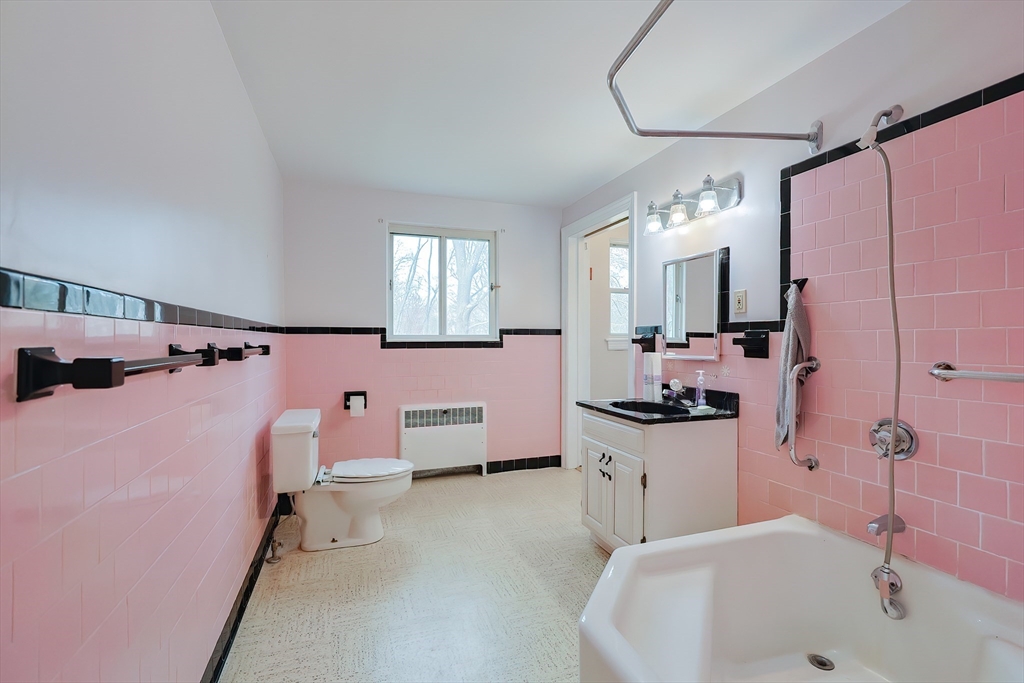 58 Cutler Drive Framingham, MA 01702 - Photo 24 of 35 a spacious bathroom with a bathtub sink and mirror