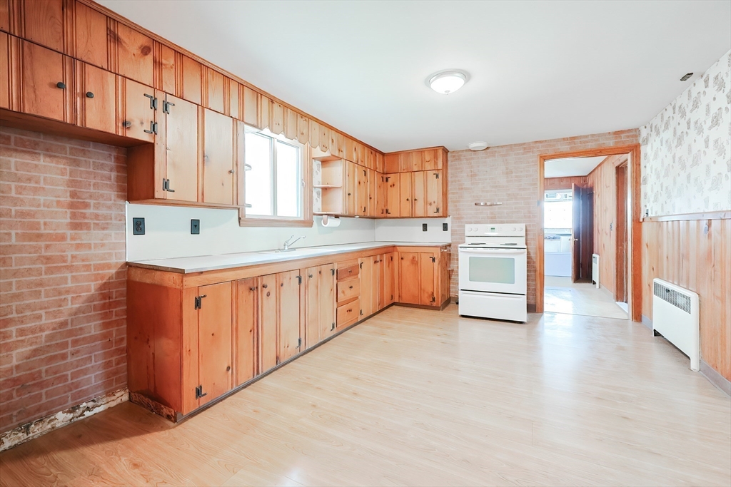 58 Cutler Drive Framingham, MA 01702 - Photo 3 of 35 a kitchen with stainless steel appliances granite countertop a stove a sink and a refrigerator
