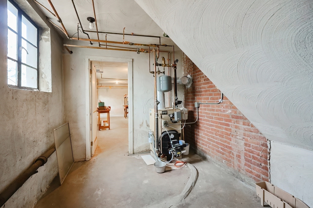 58 Cutler Drive Framingham, MA 01702 - Photo 31 of 35 a view of a livingroom with wooden floor and stairs