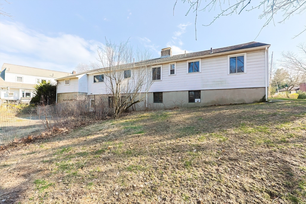 58 Cutler Drive Framingham, MA 01702 - Photo 34 of 35 a view of a house with a yard