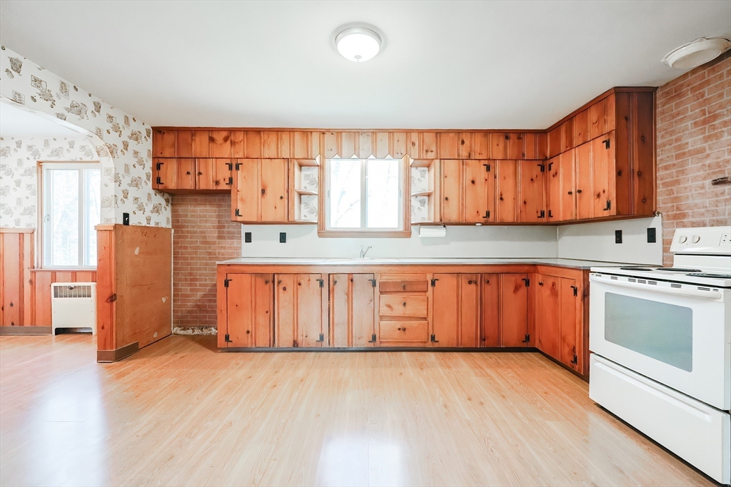 58 Cutler Drive Framingham, MA 01702 - Photo 4 of 35 an empty room with wooden floor and window