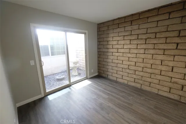 a bathroom with a granite countertop shower and a toilet