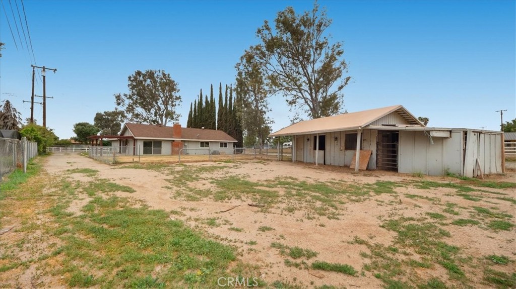 1607 Temescal Avenue Norco, CA 92860 - Photo 18 of 20 a front view of a house with a garden