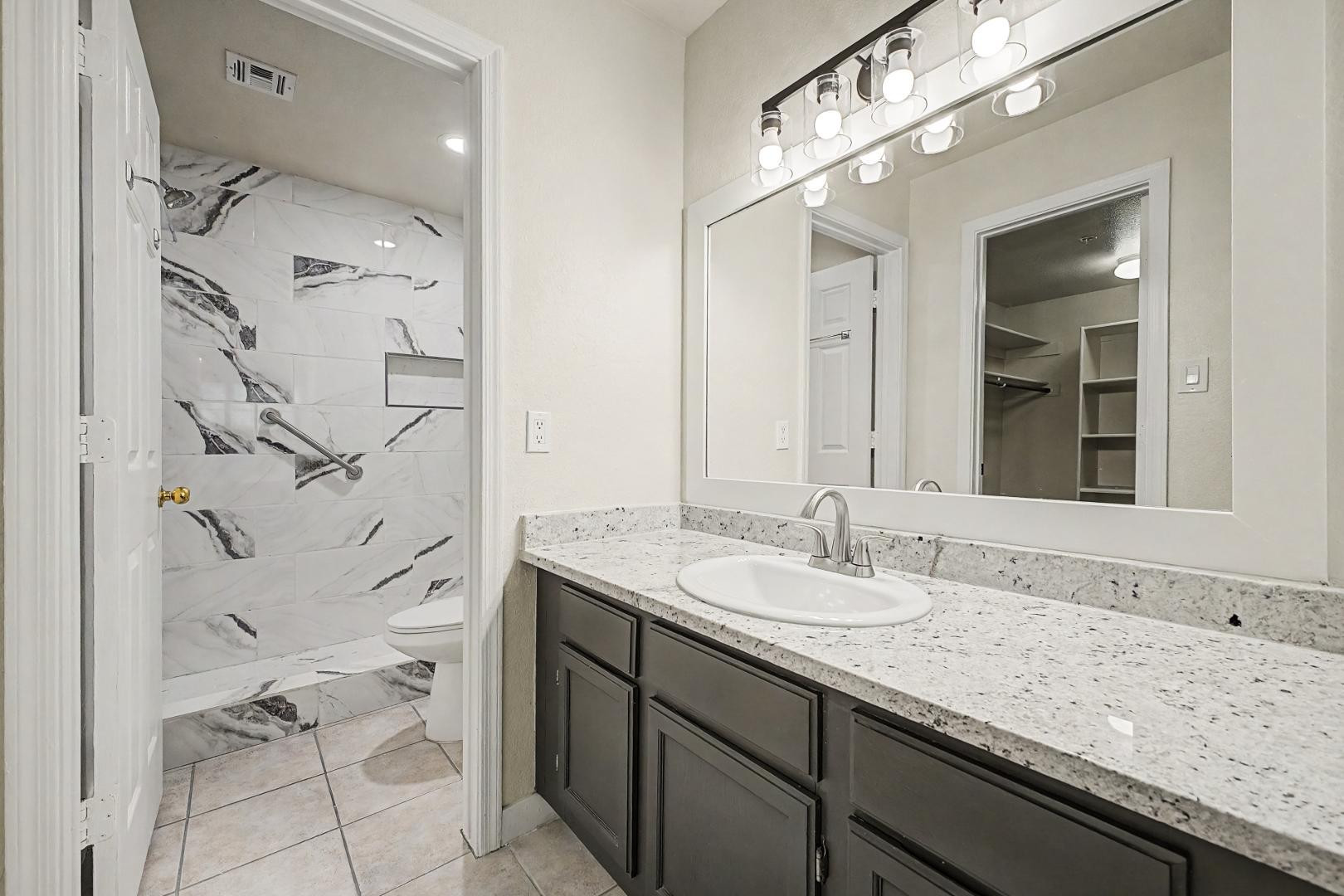 6885 East Cochise Road, Unit 142 Paradise Valley, AZ 85253 - Photo 26 of 47 a bathroom with a granite countertop sink mirror and double