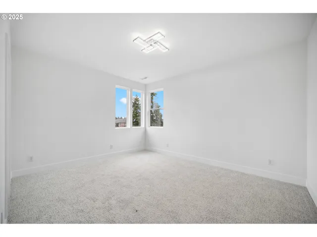 a view of empty room with windows