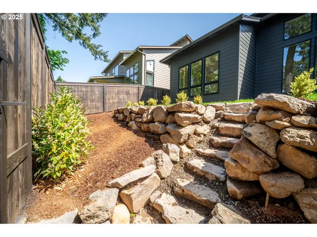 a view of a chairs and table in backyard