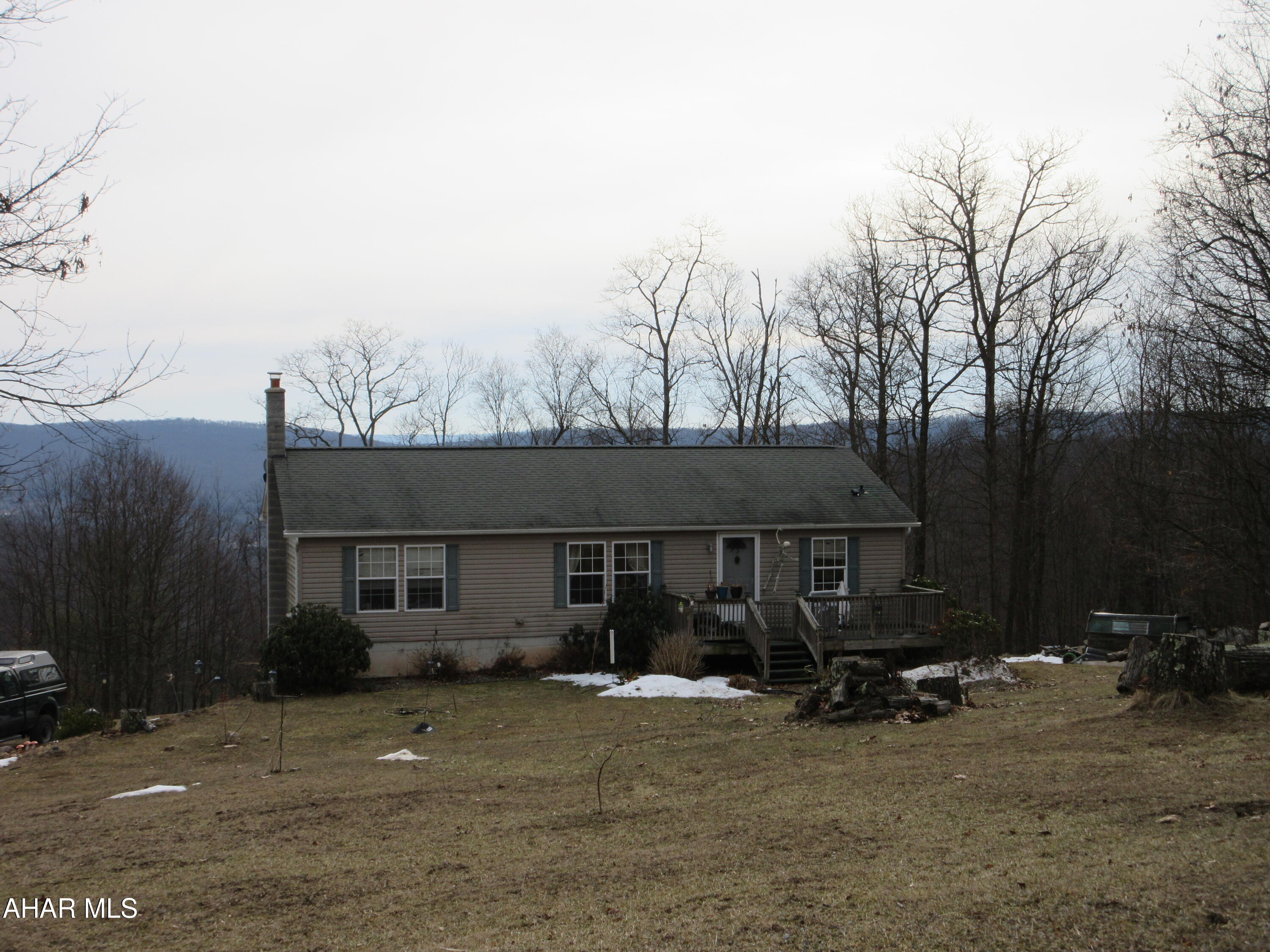 961 Baughman Hollow Road Tyrone, PA 16686 - Photo 4 of 4 a view of a house with backyard and trees