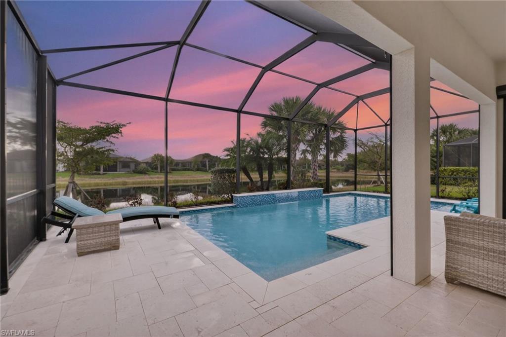 a view of swimming pool with seating area and roof
