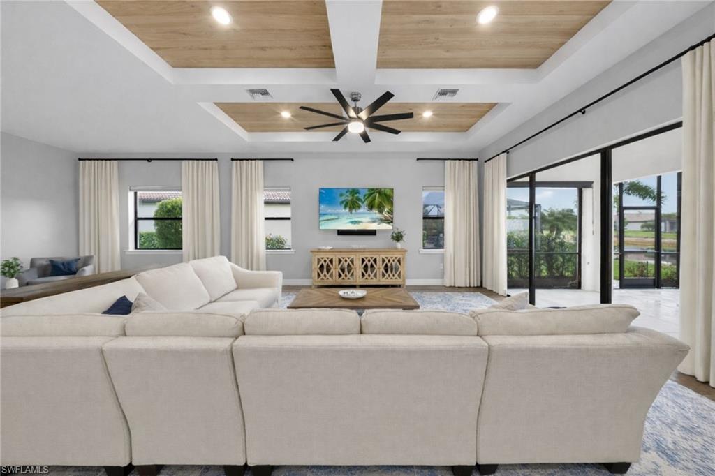 11920 Bourke Place Fort Myers, FL 33913 - Photo 3 of 45 a living room with furniture ceiling fan and a large window
