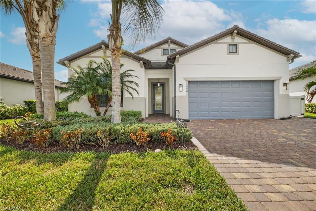 11920 Bourke Place Fort Myers, FL 33913 - Photo 33 of 45 a front view of a house with a yard