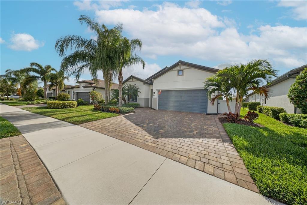 11920 Bourke Place Fort Myers, FL 33913 - Photo 34 of 45 a front view of a house with palm trees