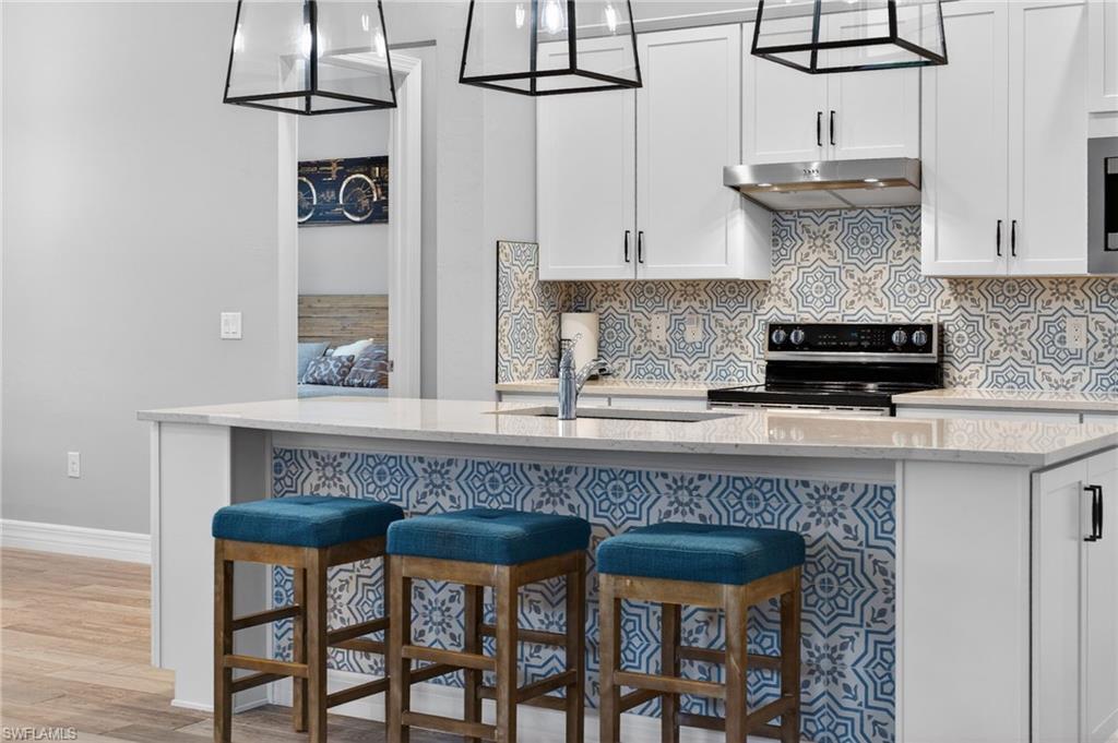 11920 Bourke Place Fort Myers, FL 33913 - Photo 10 of 45 a kitchen with a table and chairs