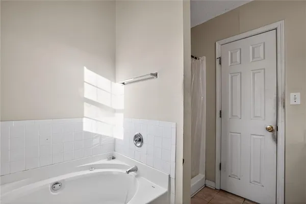 a bathroom with a granite countertop sink a toilet and a mirror