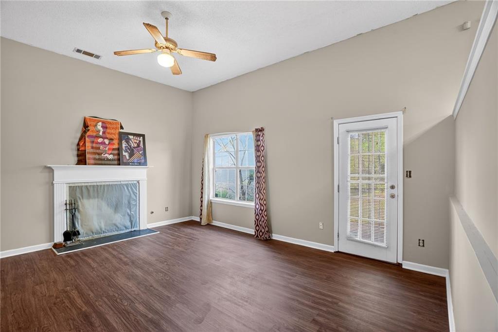 3429 Sumter Place Decatur, GA 30034 - Photo 9 of 30 wooden floor in an empty room with a window