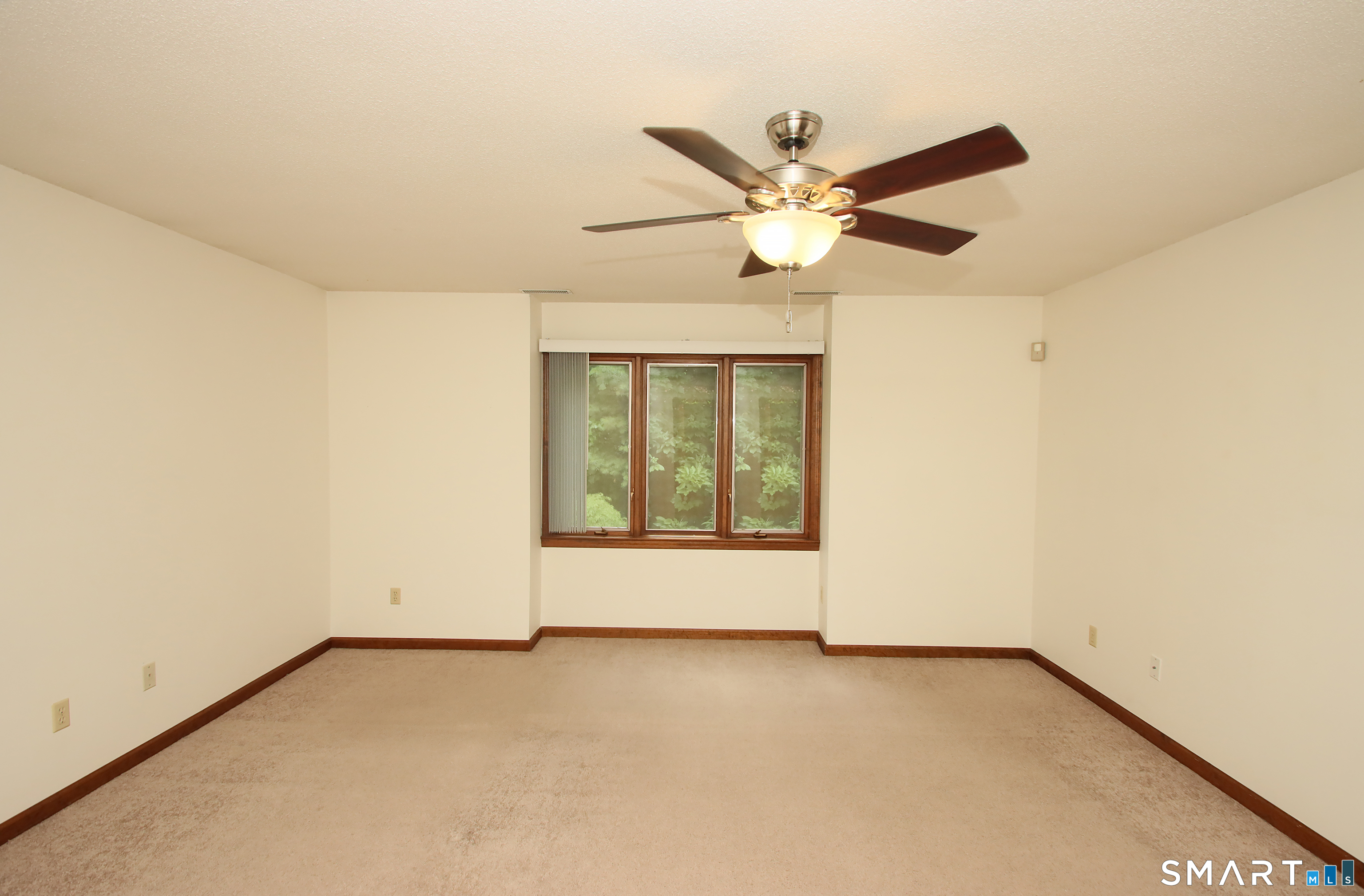 352 Center Street Wolcott, CT 06716 - Photo 20 of 40 an empty room with a window and a fan