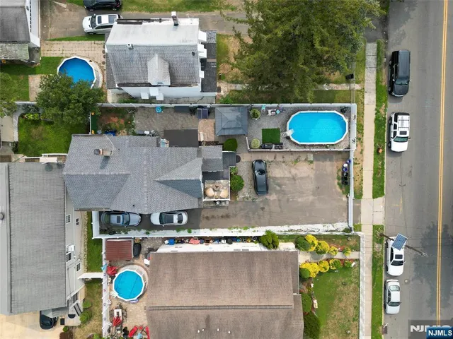 an aerial view of a house with swimming pool
