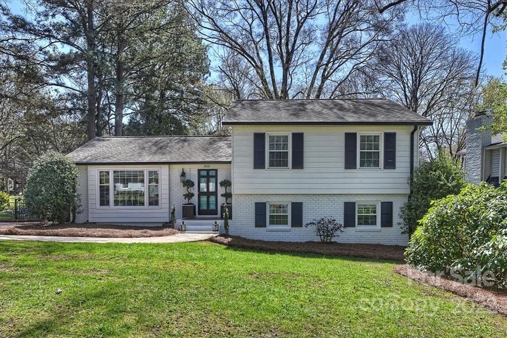 3616 Round Oak Road Charlotte, NC 28210 - Photo 1 of 48 a front view of a house with a yard