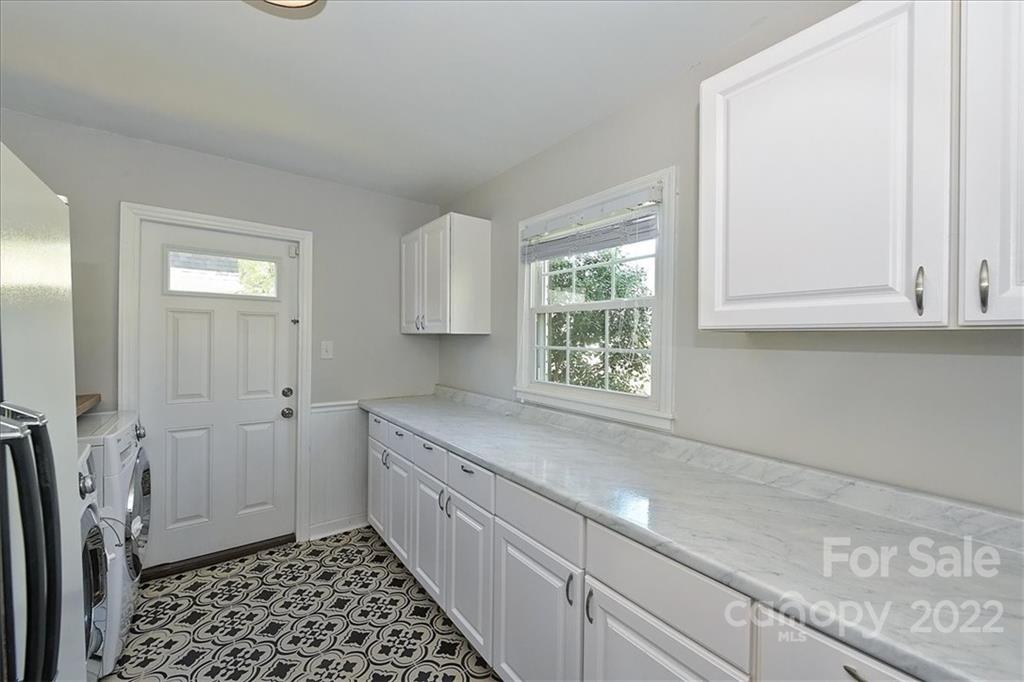 3616 Round Oak Road Charlotte, NC 28210 - Photo 20 of 48 a kitchen with a sink and cabinets