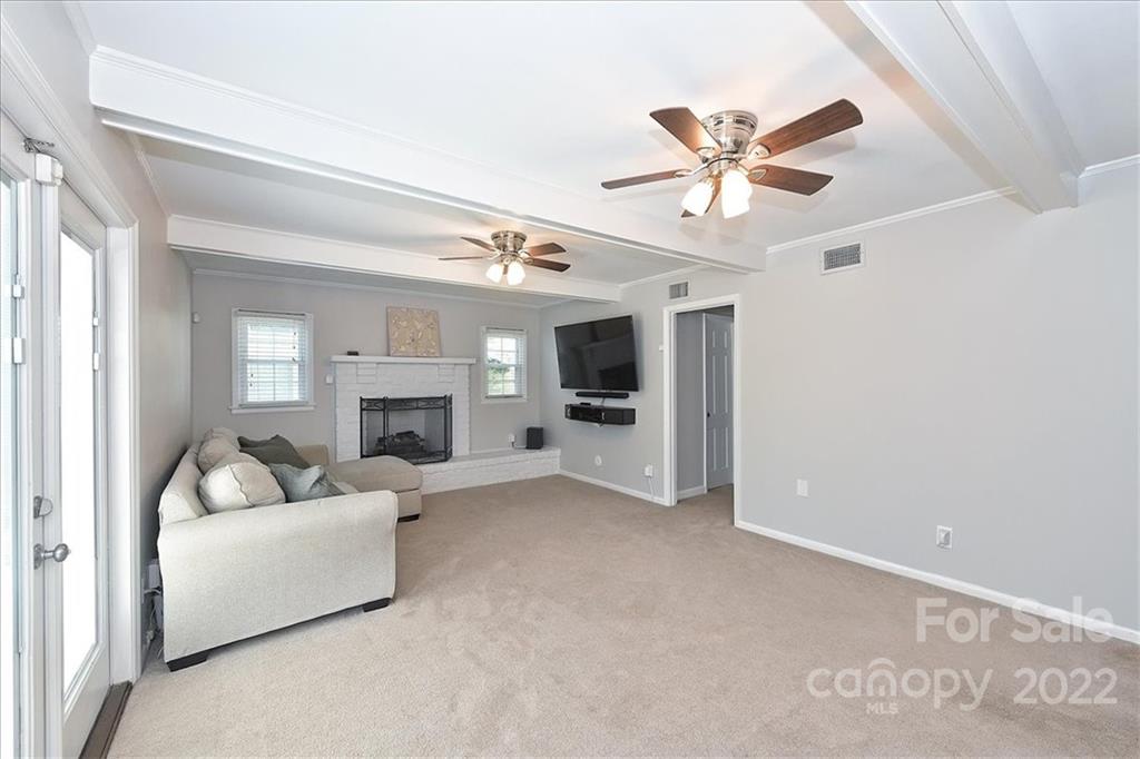 3616 Round Oak Road Charlotte, NC 28210 - Photo 32 of 48 a living room with furniture and a fireplace