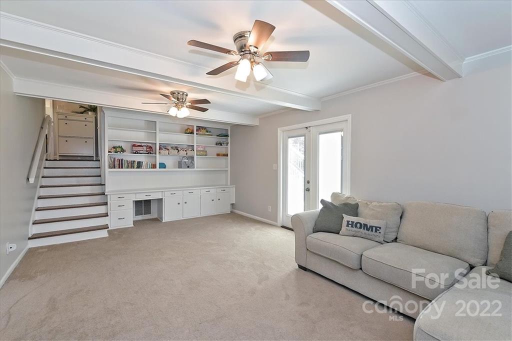 3616 Round Oak Road Charlotte, NC 28210 - Photo 35 of 48 a living room with furniture and a ceiling fan