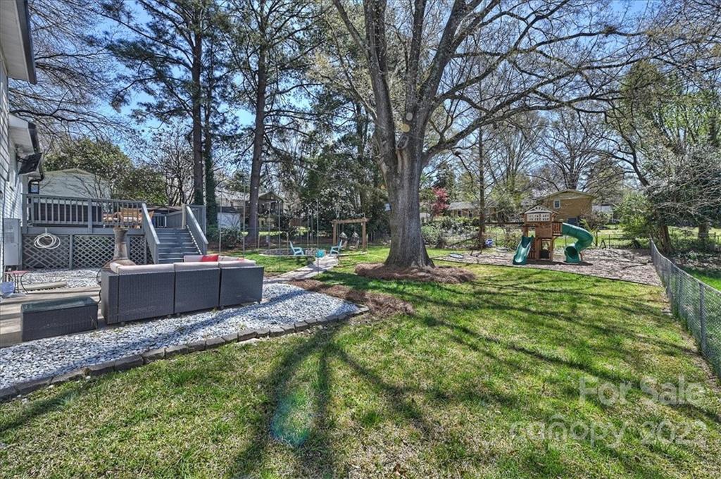 3616 Round Oak Road Charlotte, NC 28210 - Photo 40 of 48 a view of a garden with large trees