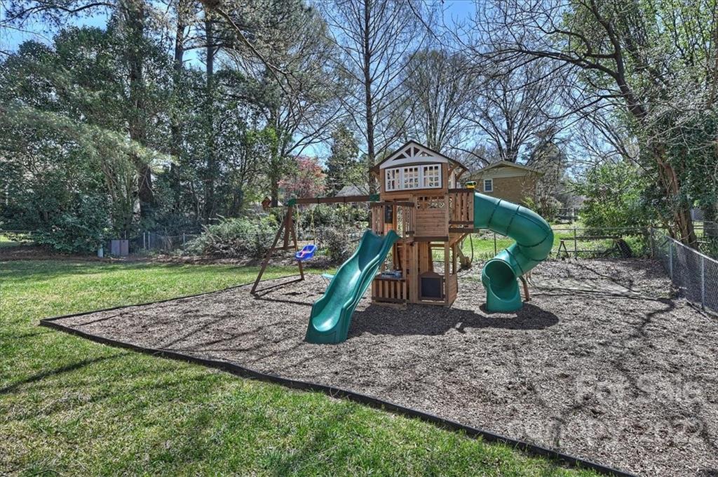 3616 Round Oak Road Charlotte, NC 28210 - Photo 46 of 48 a view of a park with swings