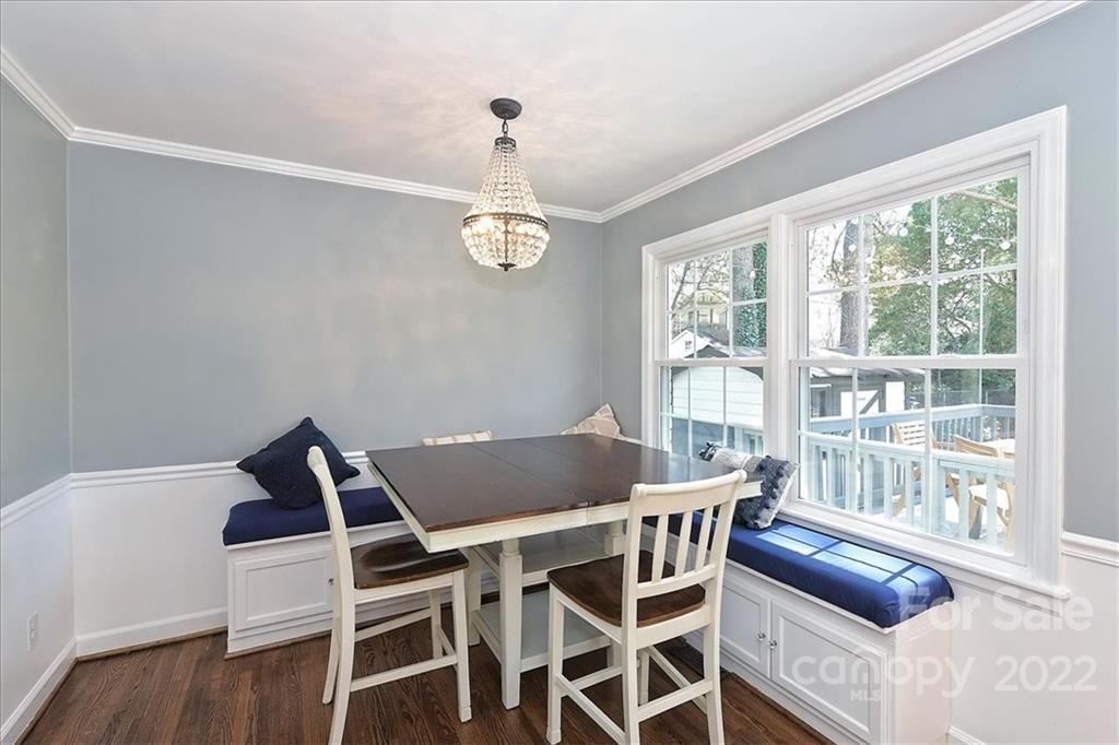 3616 Round Oak Road Charlotte, NC 28210 - Photo 10 of 48 a view of a dining room with furniture wooden floor and chandelier