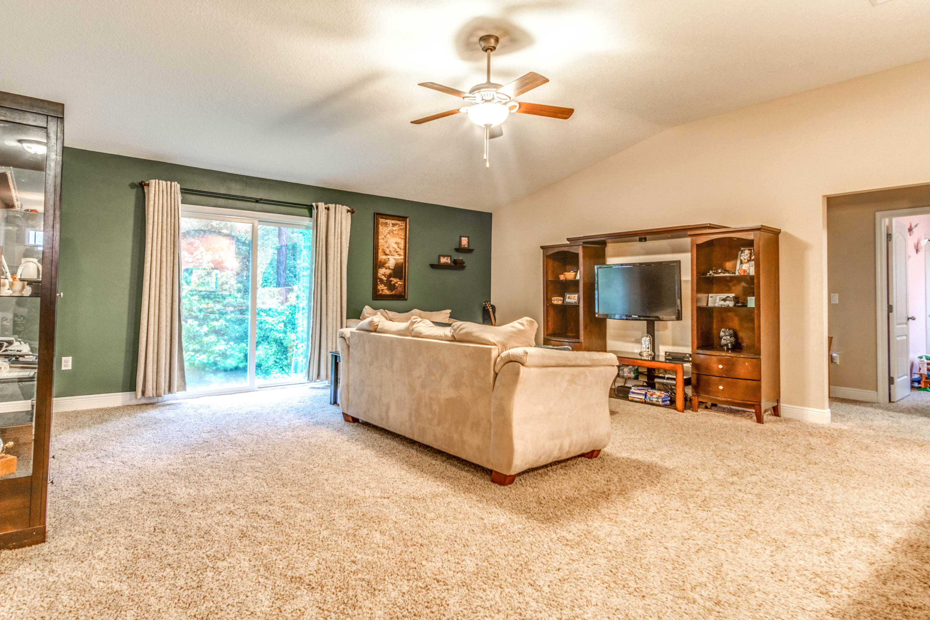 4504 Hermosa Road Crestview, FL 32539 - Photo 14 of 34 a living room with furniture and a chandelier
