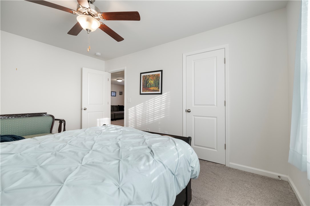 104 Village Main Anderson, SC 29621 - Photo 24 of 32 This spacious bedroom offers comfortable living with a bright, airy ambiance.