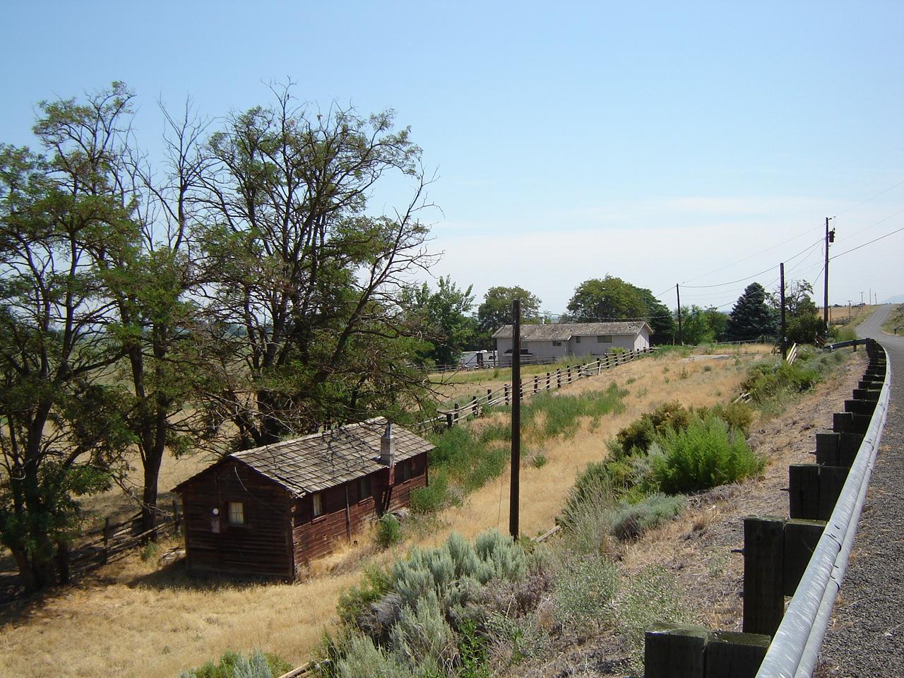 7603 Pumphouse Road Toppenish, WA 98948 - Photo 5 of 15 a view of a backyard with plants and a lake view